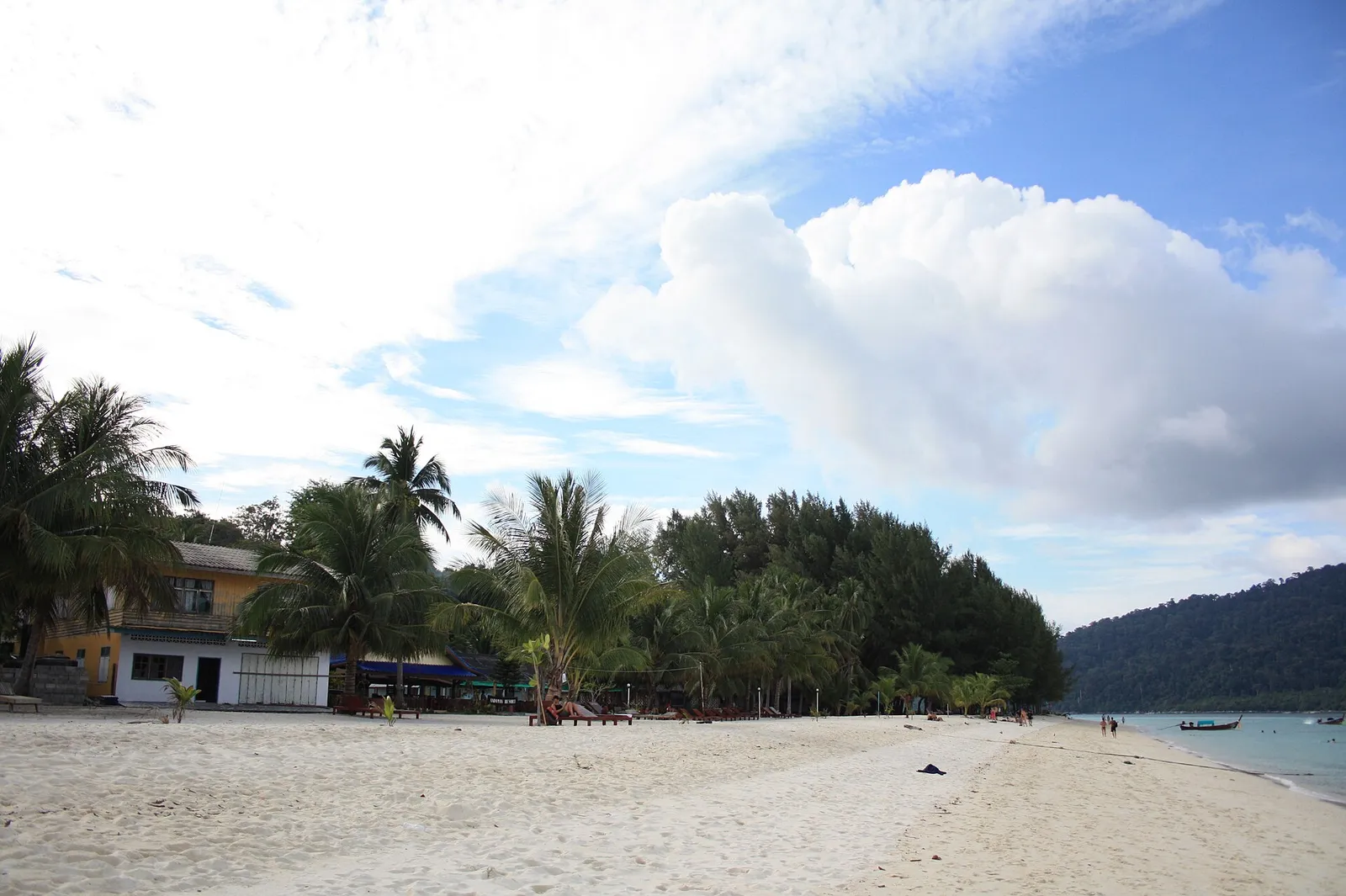 Wide sand beach with palms and guesthouses on Koh Lipe